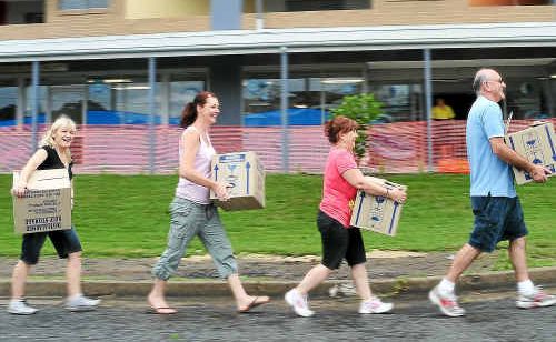 Dr Alex Joannou (right) leading staff (from left) Sheree Higgins, Lousie Hawke and Judi Wise moving medical records into the new Edgar Street clinic. Dr Alex Joannou (right) leading staff (from left) Sheree Higgins, Lousie Hawke and Judi Wise moving medical records into the new Edgar Street clinic.
